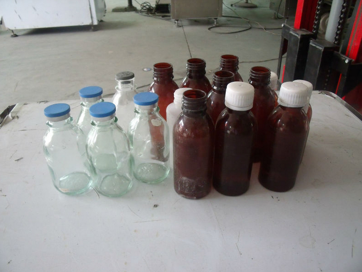 medical bottles samples बोतलें भरने के लिए कैपिंग मशीन.jpg