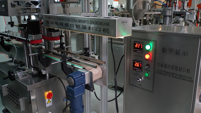 aluminum induction foil sealing machine सीलिंग मशीन स्वचालित.jpg