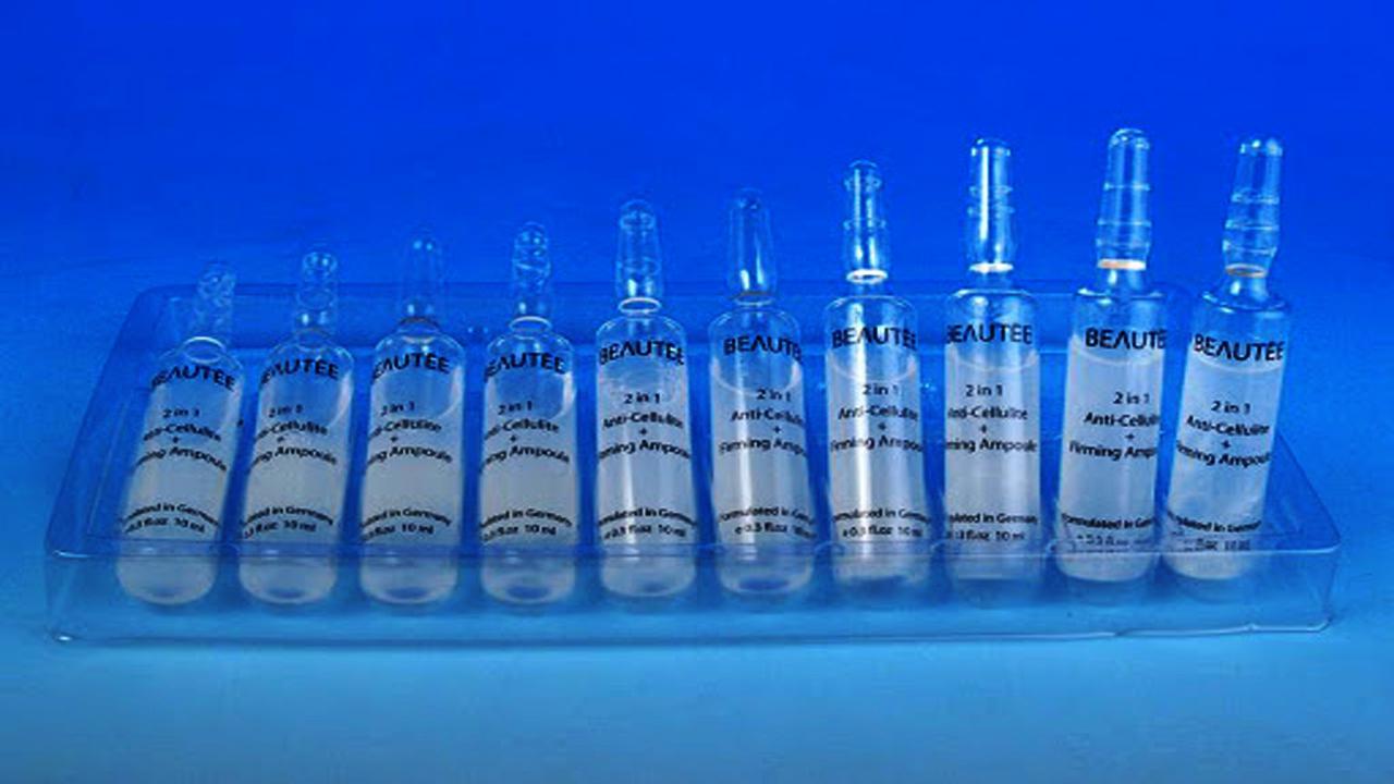 liquid solution bottles labeling machine samples final products ampoule बोतलें.jpg