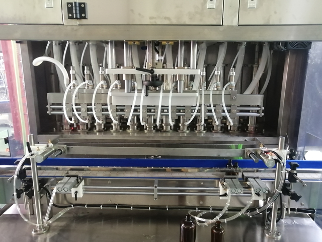 12 हेड्स फिलिंग मशीन मिक्सिंग हीटर के साथ (4).jpg